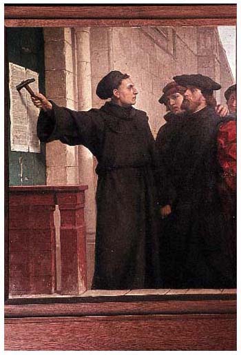 Martin Luther schlägt seine 95 Thesen an das Hauptportal der Wittenberger Schlosskirche.